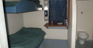 A double-bunked cell with a toilet at Acacia Prison