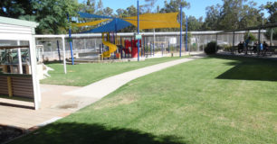 Image of outdoor childrens play ground, and seating area at visitors centre