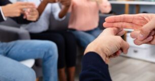 Image of a group of four people learning sign language